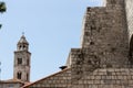 Ancient church top view, and stairs of Dubrovnik old town, hand made walls build with old bricks and stones, clock tower, bell tow Royalty Free Stock Photo