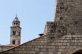 Ancient church top view, and stairs of Dubrovnik old town, hand made walls build with old bricks and stones, clock tower, bell tow Royalty Free Stock Photo