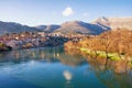 Ancient city on banks of the river. View of Trebisnjica river and Trebinje city on sunny winter day. Bosnia and Herzegovina
