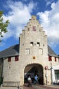 Ancient city gate cyclist and walker in Zierikzee