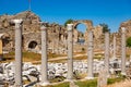 Ancient city ruins. Side. Colonnaded road and market place