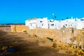 Ancient city wall of white medina of the town Asilah at ocean coast, Morocco Royalty Free Stock Photo