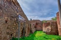 Ancient city walls and water ways in iznik made of red bricks wall covered by and grass with blue sky