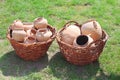 Ancient clay pots in basket Royalty Free Stock Photo