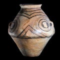 an ancient clay vase with linear patterns Trypillia culture