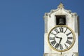 Ancient clock over blue sky with space for text