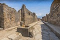 An ancient cobbled street in the ruins of Pompeii, Italy Royalty Free Stock Photo