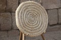 Ancient coiled straw target over wooden stand Royalty Free Stock Photo