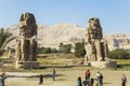 Ancient Colossi of Memnon and tourists Royalty Free Stock Photo