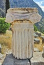 Ancient column in Ancient Greek archaeological site of Delphi, Greece Royalty Free Stock Photo
