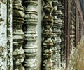 Ancient columns with moss and lichen, close up, perspective, Angkor Wat, Siem Reap, Cambodia Royalty Free Stock Photo