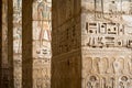 Ancient columns in a row with carved egyptian hieroglyphics Royalty Free Stock Photo