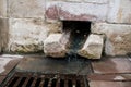 Ancient communication stones. Medieval gutter. Royalty Free Stock Photo