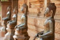 Ancient copper Buddha statues outside of the Hor Phra Keo temple in Vientiane, Laos.