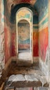 An ancient corridor reveals weathered frescoes and architectural details from a bygone era