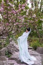 Ancient costume girl and cherry blossom Royalty Free Stock Photo