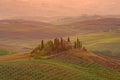 An ancient country house in September dawn. Neighborhood of the city of Val d`Orcia, Italy