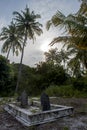 Ancient creepy graveyard with crypt and graves at the tropical local island Fenfushi