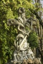 Ancient cross made of stone at the grave of sailor