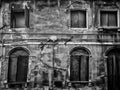 Ancient crumbling abandoned house with cracks