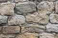 Ancient crumbling stones are located in the old fortress wall.