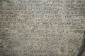 Ancient cuneiform writing script on the wall