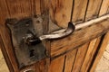 Ancient dark wooden door with metal handle