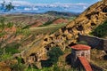 Ancient David Gareja Monastery perched atop the rolling hills of a picturesque valley in Georgia