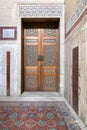 Ancient decorated door arabesque and decorated colored marble wall