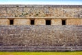 Ancient decorated wall and stairs in archeological site Uxmal