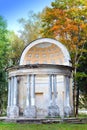 The ancient destroyed arbor in autumn park in a sunny day. Russia.