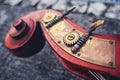 An ancient detail of the cello of the Siz mahogany and brass details on the background of the old pavers. Wooden part of double ba