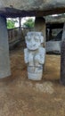 An ancient dolmen with anthropo-zoomorphic sculpture of a monkey at Colombian San Agustin archaeological park. Royalty Free Stock Photo