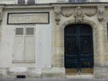 Ancient door in an ancient building of Paris in France.