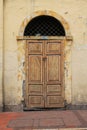Ancient door with colorful painted wood grain in Ecuador