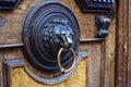 An ancient door handle with metal lion head in Tbilisi, Georgia Royalty Free Stock Photo