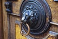 An ancient door handle with metal lion head in Tbilisi, Georgia Royalty Free Stock Photo