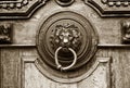 An ancient door handle with metal lion head in Tbilisi, Georgia Royalty Free Stock Photo