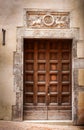 Ancient wooden door of a historic building in Perugia (Tuscany, Italy) Royalty Free Stock Photo