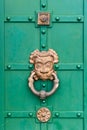 Ancient door with a large metal handle Royalty Free Stock Photo