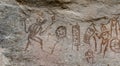 ancient drawings and writings inside a cave of a wall