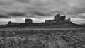 Ancient Duffus castle ruins atop a rocky hill, surrounded by clouds and overcast skies