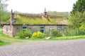 Idyllic ancient Dutch cottage with mossy roof, Eemnes, Netherlands Royalty Free Stock Photo