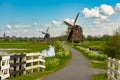 Ancient Dutch windmills in a countryside of Kinderdijk, Netherlands, Holland, rural landscape, lifestyle
