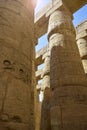 Ancient Egyptian hieroglyphs and symbols carved on columns of the complex of Karnak temple. Great Hypostyle Hall at Temples of Royalty Free Stock Photo
