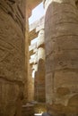 Ancient Egyptian hieroglyphs and symbols carved on columns of the complex of Karnak temple. Great Hypostyle Hall Royalty Free Stock Photo