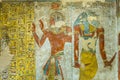 Ancient egyptian painting of two gods in a tomb in the valley of Royalty Free Stock Photo