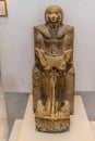 Ancient Egyptian statue of a seated man Royalty Free Stock Photo