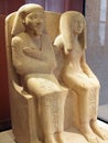 Ancient Egyptian Stone Statues, Seated Male and Female, Louvre Museum, Paris, France Royalty Free Stock Photo