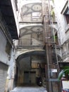 Ancient elevator in a characteristic courtyard of an ancient building of Naples in Italy. Royalty Free Stock Photo